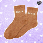 Chaussettes à paillettes orange foncé avec écrit "bichette" au niveau de la cheville
