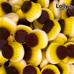 Bonbon en forme de flan au caramel. Il a trois couches de couleurs différentes : marron, jaune et blanc. Sa texture est lisse et molle.