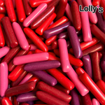 Bonbons en forme de craies de couleur rouge, rose et violette. Texture lisse et compacte avec une coque croquante.