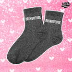 Chaussettes à paillettes noir avec écrit "bringueuse" au niveau de la cheville.