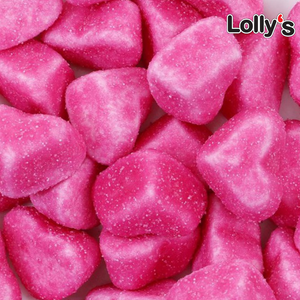 Bonbon en forme de coeur acidulés couleur rose en gros plan