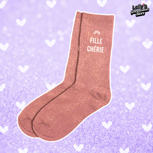 Chaussettes à paillettes rose foncé avec écrit "fiche chérie" au niveau de la cheville