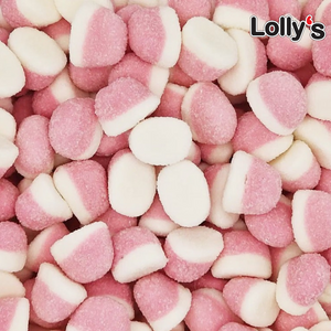 Bonbon en forme de rond de couleur rose pâle et blanche en gros plan goût fraise.